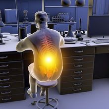 A person slouches while sitting at their laboratory bench, causing musculoskeletal strain, indicated by a yellow highlight on their spine.