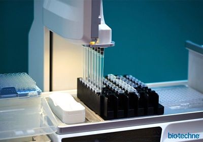A semi-automated liquid handling robot with a multi-channel attachment for pipetting samples into an array format.