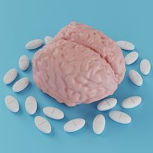 a brain surrounded by pills