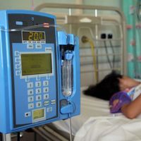 a child in a hospital bed