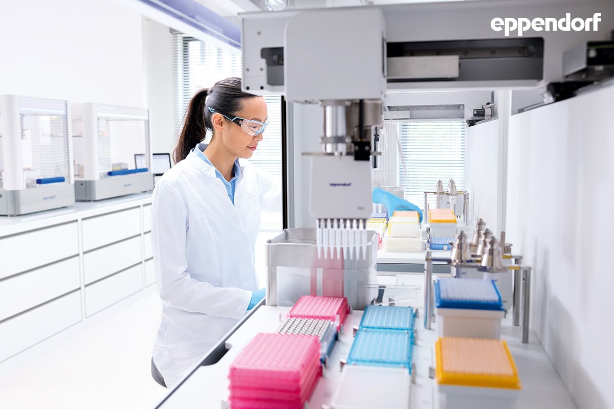 A photo of a scientist working with an EpMotion® liquid handler.
